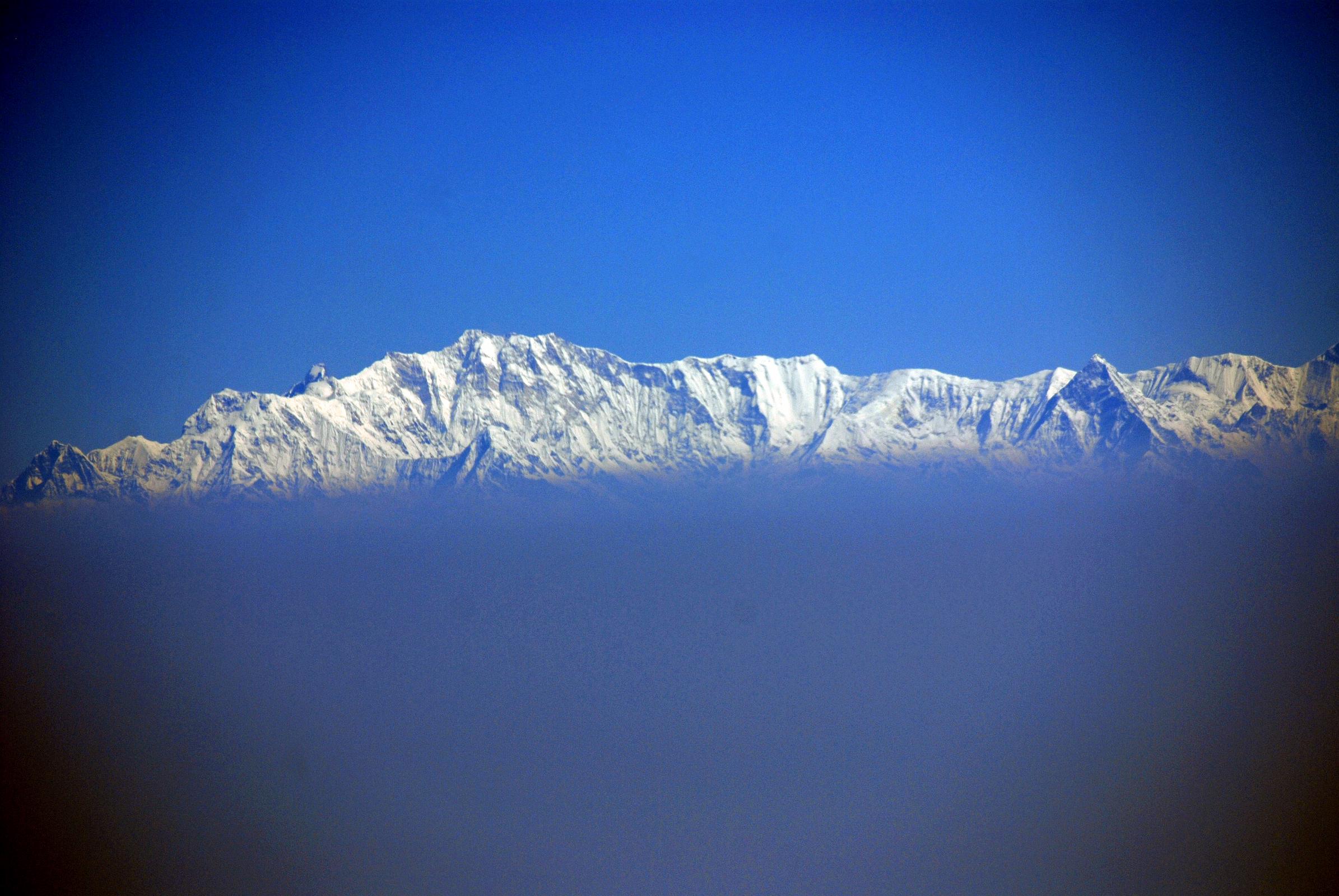 01 Flight To Kathmandu 07 Annapurna South Face The early morning flight from Doha to Kathmandu turned into a mountain flight with the Annapurna I South Face perfectly in view. Machapuchare is the pointy peak to the right.